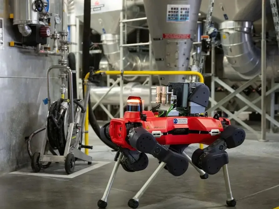 Four-legged industrial robot inspecting factory floor